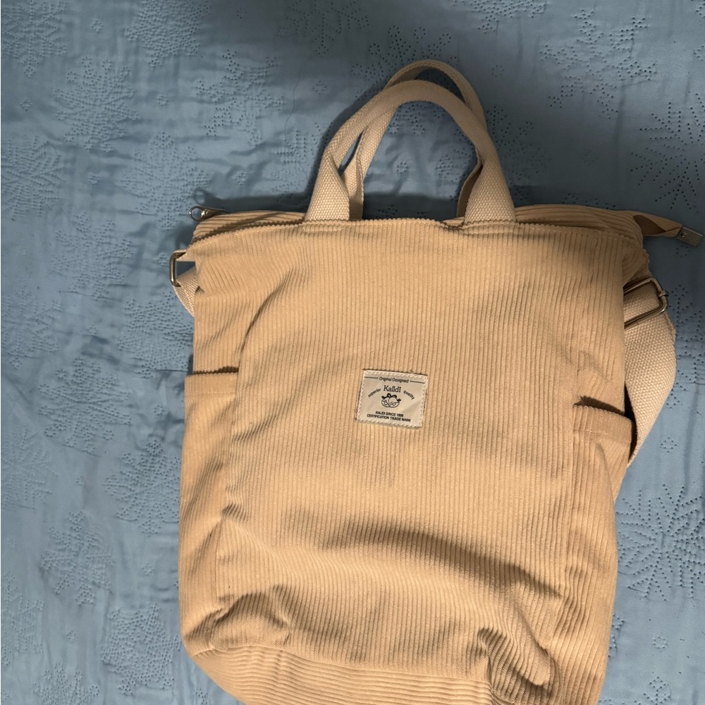 Corduroy Cream Canvas Backpack with Zipper Closure and Textured Design